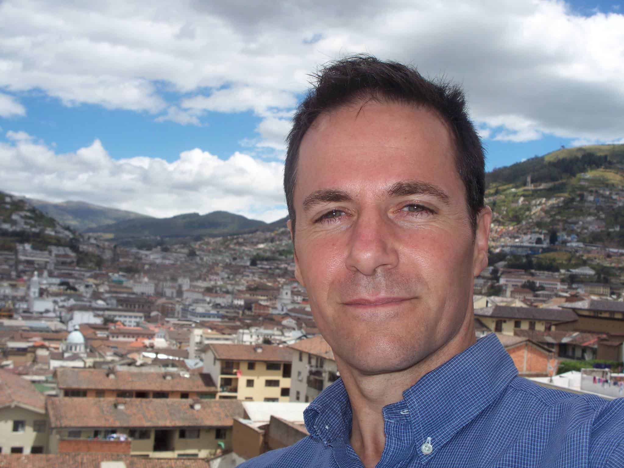 Steve Roller taking a selfie overlooking the city of Quito, Ecuador