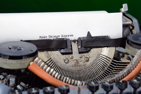 A type writer that just had typed on it the words Make Things Happen